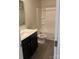 Bathroom with a shower, toilet, sink, and black vanity at 1305 Dodd St, Shelby, NC 28152
