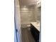 Modern bathroom with dark vanity, white countertop, and wood-look flooring at 1305 Dodd St, Shelby, NC 28152