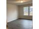 Empty bedroom with neutral walls and wood-look flooring at 1305 Dodd St, Shelby, NC 28152