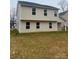 Back exterior view of a two-story home with a small backyard at 1305 Dodd St, Shelby, NC 28152