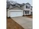 Two-story home with a two-car garage and a large driveway at 1305 Dodd St, Shelby, NC 28152