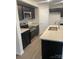 Kitchen with dark cabinets, stainless steel appliances, and an island at 1305 Dodd St, Shelby, NC 28152