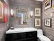 Powder room with artistic wallpaper, vanity, and mirror at 1401 Scotland Ave, Charlotte, NC 28207