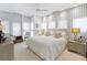White bedroom with large windows, floor-to-ceiling curtains, and sitting area at 1401 Scotland Ave, Charlotte, NC 28207