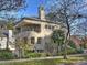 Modern home exterior with a metal roof, balcony, and landscaping at 1401 Scotland Ave, Charlotte, NC 28207