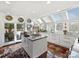 Bright, updated kitchen with white cabinets, a large island, and stainless steel appliances at 1401 Scotland Ave, Charlotte, NC 28207