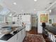 Modern kitchen with white cabinets, dark countertops, and a center island at 1401 Scotland Ave, Charlotte, NC 28207