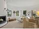 Living area with fireplace, wall art, and comfortable seating at 1401 Scotland Ave, Charlotte, NC 28207