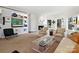 Open-concept living room with built-in shelves, fireplace, and art at 1401 Scotland Ave, Charlotte, NC 28207