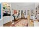 Home office with lots of natural light, built-in shelving, and a sitting area at 1401 Scotland Ave, Charlotte, NC 28207