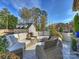 Outdoor patio area with comfortable seating and lush greenery at 1401 Scotland Ave, Charlotte, NC 28207