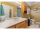 Clean bathroom with wood cabinets and a large mirror at 1976 Mcilwain Rd, Lancaster, SC 29720