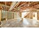 Unfinished basement with exposed framing, insulation, and concrete floor at 319 Harvard Dr, Albemarle, NC 28001