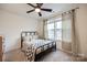 Cozy bedroom with black metal bed frame and plaid bedding at 577 Red Wolf Ln, Clover, SC 29710