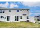 Backyard of a two-story home with white siding and fenced yard at 14902 Tamarack Dr, Charlotte, NC 28278