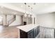 Kitchen island overlooking the living room with a staircase and fireplace at 14910 Tamarack Dr, Charlotte, NC 28278