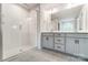 Primary bathroom with double vanities and a large walk-in shower at 14914 Tamarack Dr, Charlotte, NC 28278