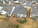 Aerial view of house, backyard patio, and surrounding neighborhood at 15175 Legend Oaks Ct, Fort Mill, SC 29707