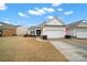 House exterior with a two-car garage and landscaping at 15175 Legend Oaks Ct, Fort Mill, SC 29707