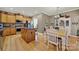 Kitchen features island, wood cabinets, granite countertops, and breakfast area at 15175 Legend Oaks Ct, Fort Mill, SC 29707