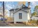 Exterior view of a two-story home with a backyard deck and surrounding trees at 3814 Durham Ln, Charlotte, NC 28269