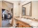 Bathroom with a single vanity, a large mirror, and access to a home office area at 3814 Durham Ln, Charlotte, NC 28269