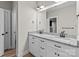 Bathroom featuring double sinks, a large mirror, and white cabinets at 399 Spring St, Richfield, NC 28137