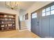 Bright foyer with hardwood floors, double door entry, and a staircase at 4024 S Rocky River Rd, Monroe, NC 28112