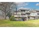 Rear exterior view of a two-story home with a balcony and ground-level patio at 51 Old Post Rd, Lake Wylie, SC 29710