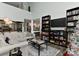 Bright living room with vaulted ceiling, built-in shelves, and a view of the kitchen at 51 Old Post Rd, Lake Wylie, SC 29710