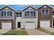 Exterior view of a two-story townhome with a two-car garage at 520 Trading Post Ln, York, SC 29745