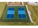 Two pickleball courts with blue and green surfaces, benches, and a black fence at 520 Trading Post Ln, York, SC 29745