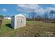 White storage shed in grassy backyard at 739 Bethesda Rd, Statesville, NC 28677