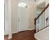 Hardwood floor entryway with staircase and interior door at 7771 Sedgebrook E Dr, Stanley, NC 28164