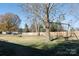 Large fenced backyard with a swing set and plenty of space for outdoor activities at 982 Daves Rd, York, SC 29745