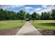 Community park with open green space, walking paths, and covered picnic area at 108 Sherman Oaks St, Mooresville, NC 28115