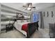 Stylish bedroom with a striking accent wall and a cozy bed at 11916 Henderson Hill Rd, Huntersville, NC 28078