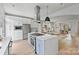 Modern kitchen with stainless steel appliances and a stunning quartz countertop at 12239 Monteith Grove Dr, Huntersville, NC 28078