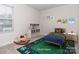 Virtually staged bedroom with a bed, rocking horse, and play area at 1244 31St St # 6, Conover, NC 28613