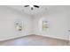 Bright, empty bedroom with wood-look flooring and large windows at 126 Hemphill Ave, Chester, SC 29706