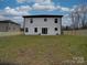 Large backyard with a view of the home's exterior at 1308 Pleasant Plains Rd, Matthews, NC 28105