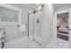 Modern bathroom with marble shower,granite countertop, and updated fixtures at 1308 Pleasant Plains Rd, Matthews, NC 28105
