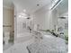 Bathroom boasts granite countertops and a large soaking tub at 1308 Pleasant Plains Rd, Matthews, NC 28105