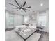 Spacious bedroom with large windows and ceiling fan at 1308 Pleasant Plains Rd, Matthews, NC 28105