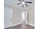 Bedroom with hardwood floors, neutral walls, and an open door at 1308 Pleasant Plains Rd, Matthews, NC 28105