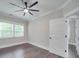 Spacious bedroom with hardwood floors and neutral walls at 1308 Pleasant Plains Rd, Matthews, NC 28105