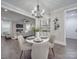 Open concept dining room with view of living room and kitchen at 1308 Pleasant Plains Rd, Matthews, NC 28105