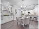 Modern kitchen with white cabinets, granite counters, and breakfast bar at 1308 Pleasant Plains Rd, Matthews, NC 28105