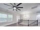 Spacious landing with ceiling fan, chandelier, and hardwood floors at 1308 Pleasant Plains Rd, Matthews, NC 28105