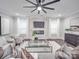 Spacious living room with fireplace and large TV at 1308 Pleasant Plains Rd, Matthews, NC 28105
